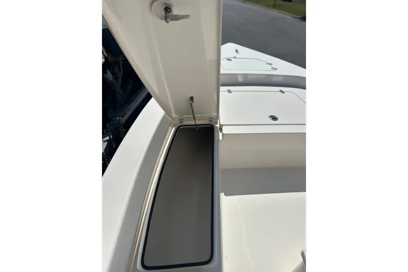 Slide: The Image of Open storage compartment on 2023 Pathfinder 2200 TRS boat, showcasing interior space. - 6