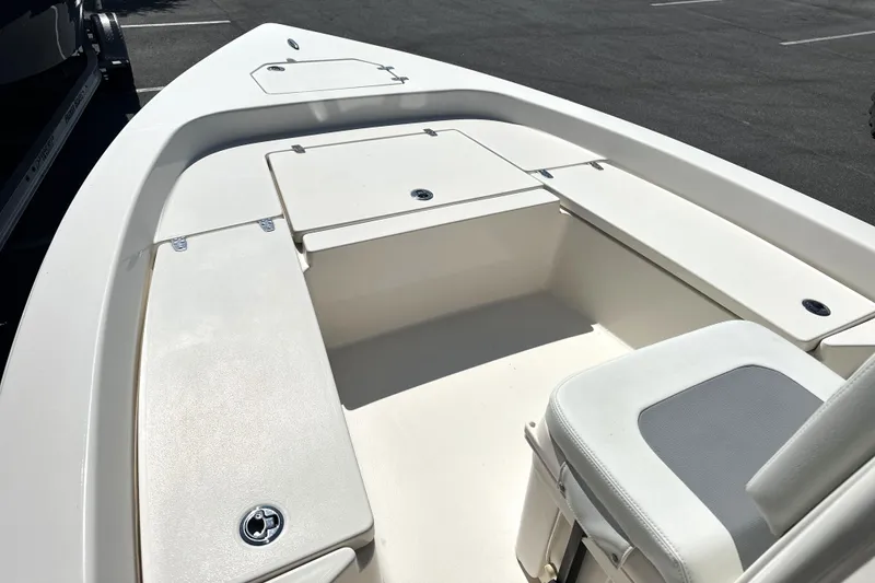 Slide: The Image of 2023 Pathfinder 2200 TRS boat interior with seating and storage compartments. - 8