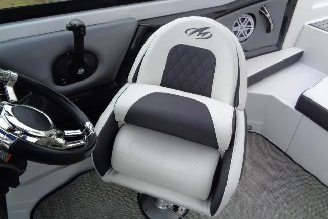 Slide: The Image of Captain's seat in 2019 Monterey 218SS Super Sport boat, featuring sleek design and modern controls. - 10