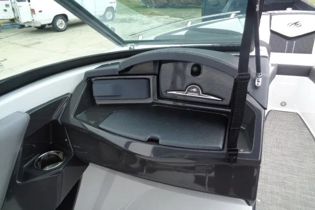 Slide: The Image of 2019 Monterey 218SS Super Sport boat dashboard with storage compartment and sleek design. - 11