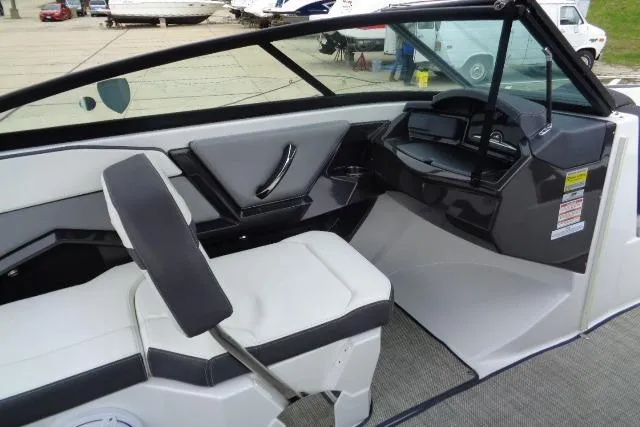 Slide: The Image of 2019 Monterey 218SS Super Sport boat interior with sleek seating and modern dashboard design. - 12