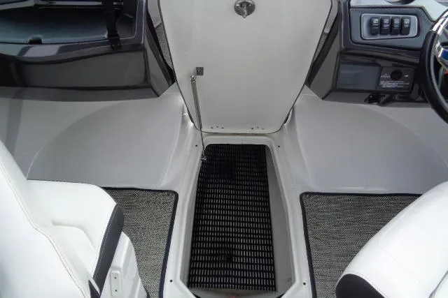Slide: The Image of Interior view of a 2019 Monterey 218SS Super Sport boat, featuring seating and control panel. - 14