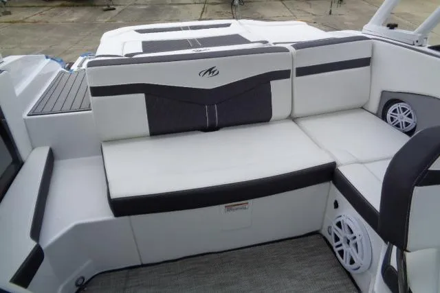 Slide: The Image of 2019 Monterey 218SS Super Sport boat interior with white and black seating, featuring built-in speakers. - 18