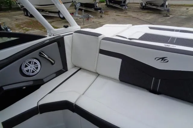 Slide: The Image of 2019 Monterey 218SS Super Sport boat interior with white and black seating. - 19