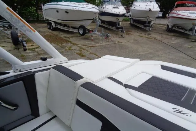 Slide: The Image of 2019 Monterey 218SS Super Sport boat interior with other boats in the background. - 20