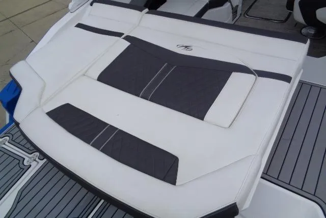 Slide: The Image of 2019 Monterey 218SS Super Sport boat seating with white and black upholstery. - 21