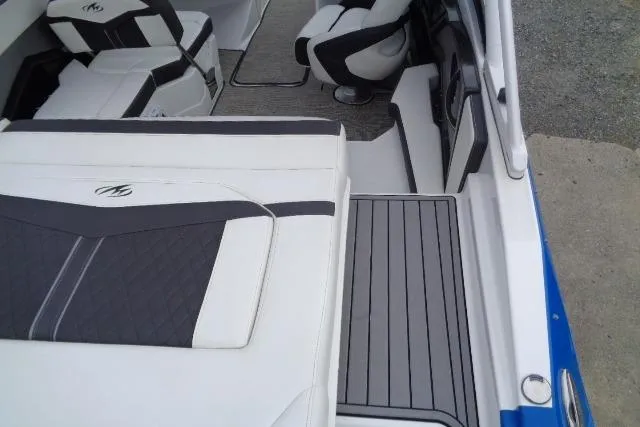 Slide: The Image of 2019 Monterey 218SS Super Sport boat interior with white and black seating. - 23