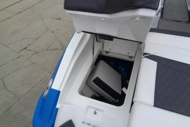 Slide: The Image of 2019 Monterey 218SS Super Sport boat storage compartment with open lid. - 24