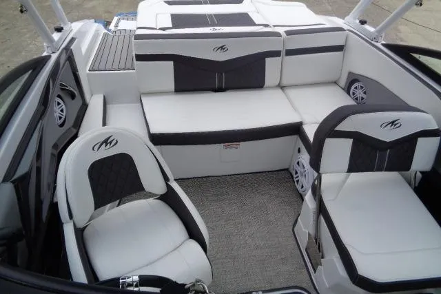 Slide: The Image of 2019 Monterey 218SS Super Sport boat interior with white and black seating. - 25