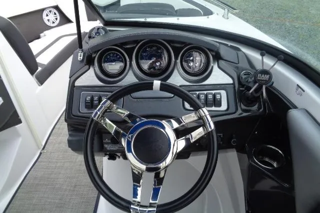 Slide: The Image of Dashboard of a 2019 Monterey 218SS Super Sport boat with steering wheel and gauges. - 8