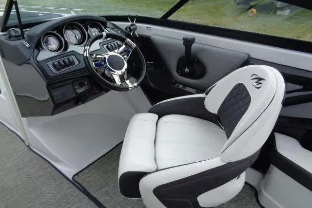 Slide: The Image of 2019 Monterey 218SS Super Sport boat interior with steering wheel and captain's chair. - 9