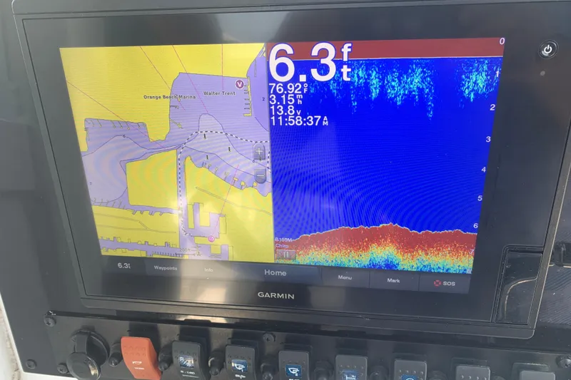Slide: The Image of Garmin marine display on 2020 Sea Hunt Ultra 275 SE showing depth and navigation data. - 5