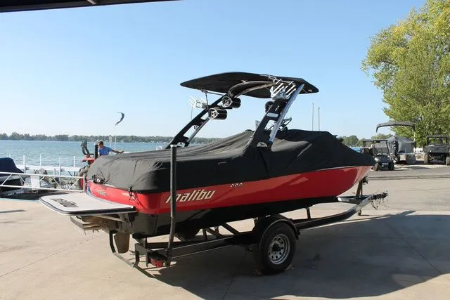Slide: The Image of 2011 Malibu Wakesetter 20 VTX boat on trailer by the lake. - 16