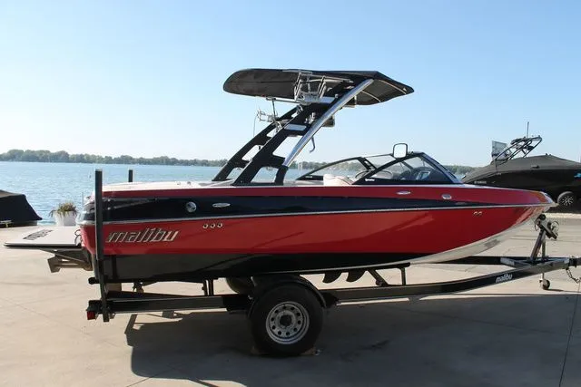 Slide: The Image of 2011 Malibu Wakesetter 20 VTX boat by the lakeside. - 3