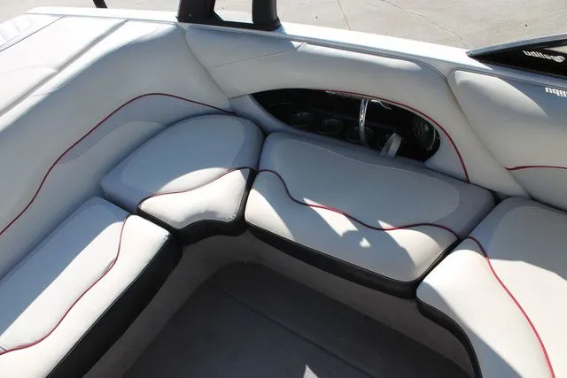 Slide: The Image of Interior of a 2011 Malibu Wakesetter 20 VTX boat with white upholstery. - 5