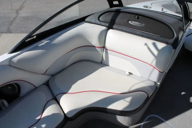 Slide: The Image of Interior of a 2011 Malibu Wakesetter 20 VTX with white seating. - 9