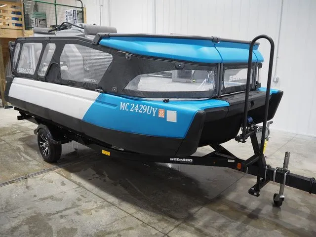 The Image of 2023 Sea-Doo Switch 16 on trailer in warehouse. - 1