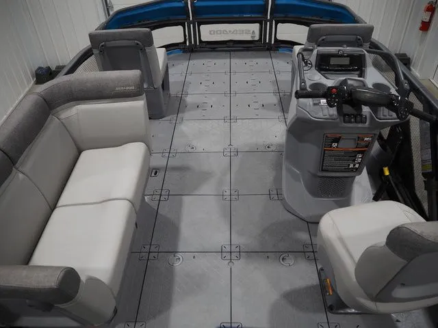 Slide: The Image of Interior of 2023 Sea-Doo Switch 16 with gray seating and control console. - 13