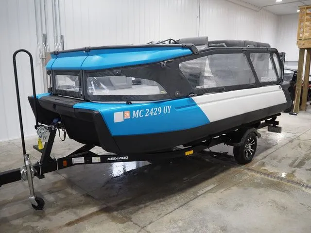 Slide: The Image of 2023 Sea-Doo Switch 16 on trailer in warehouse. - 3
