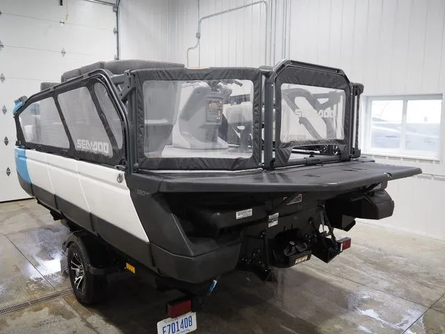 Slide: The Image of 2023 Sea-Doo Switch 16 parked in a garage. - 4