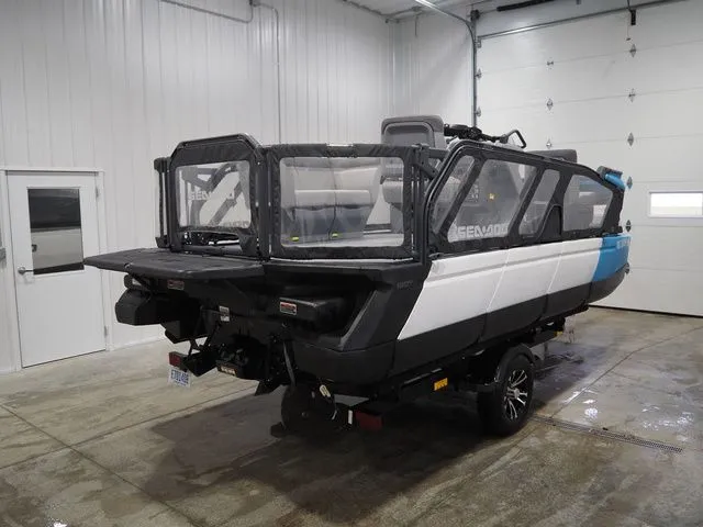 Slide: The Image of 2023 Sea-Doo Switch 16 parked in a garage. - 5