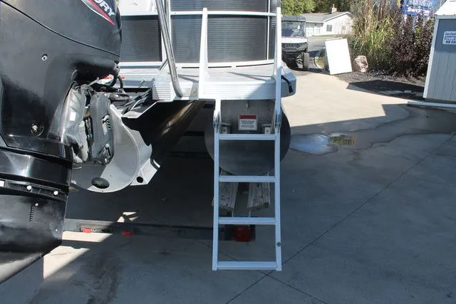 Slide: The Image of Bennington 22 SSRCX 2021 with motor and ladder on trailer. - 12
