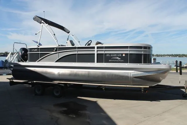 Slide: The Image of 2021 Bennington 22 SSRCX pontoon boat on trailer. - 3