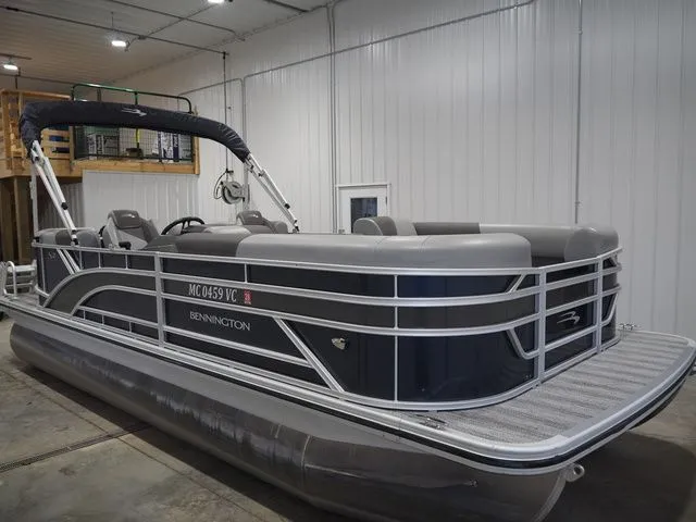 The Image of Bennington S Quad Bench 21 SSR 2025 pontoon boat in warehouse. - 1