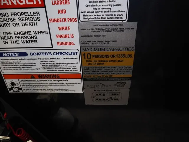 Slide: The Image of Warning labels on 2025 Bennington S Quad Bench 21 SSR boat. - 11