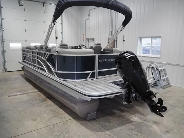Slide: The Image of Bennington S Quad Bench 21 SSR 2025 pontoon boat in warehouse. - 4