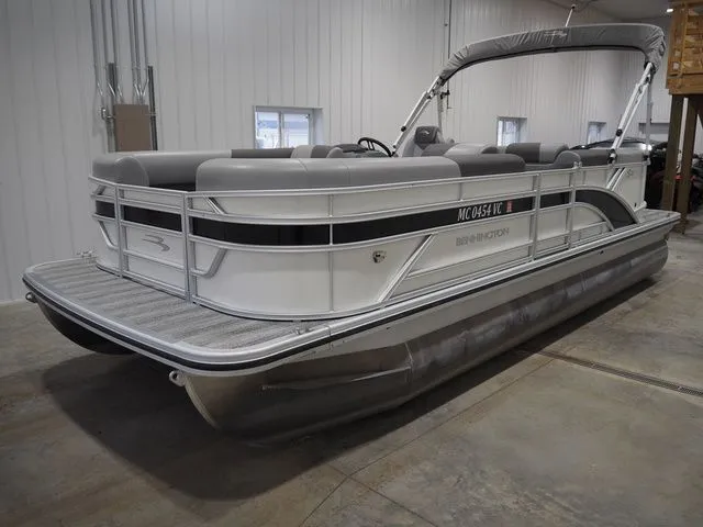 The Image of 2025 Bennington S Quad Bench 21 SSR pontoon boat in showroom. - 1