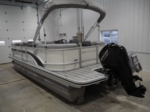 Slide: The Image of Bennington S Quad Bench 21 SSR 2025 pontoon boat in warehouse. - 5