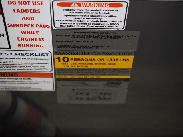 Slide: The Image of Warning labels and capacity information on a Bennington boat. - 11