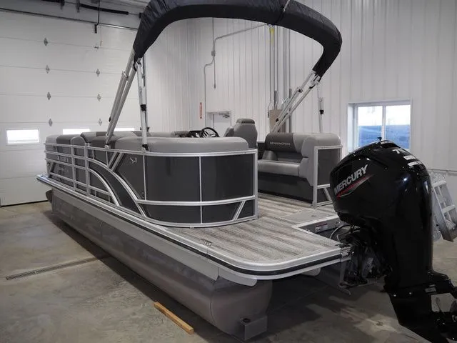 Slide: The Image of 2025 Bennington S Quad Bench 21 SSR pontoon boat in warehouse. - 4