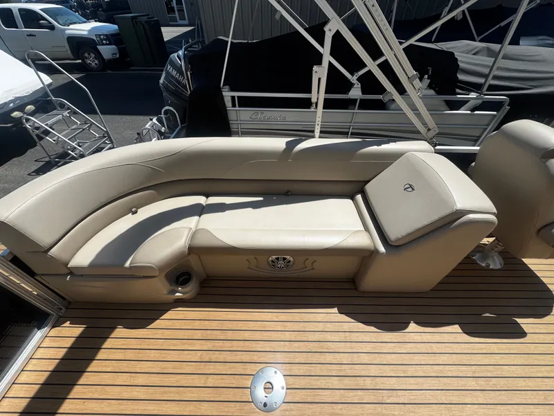 Slide: The Image of Interior of a 2017 Tahoe LTZ2685 pontoon boat with beige seating area. - 2