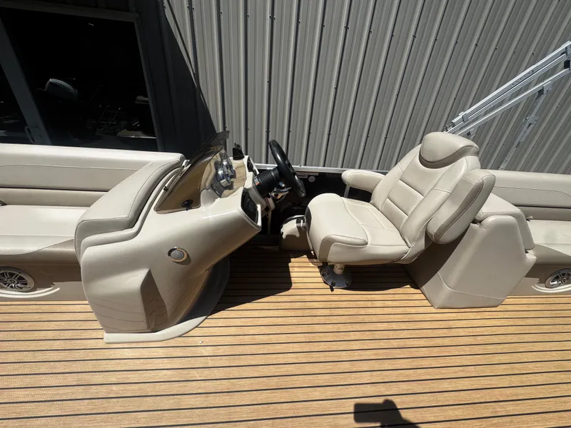 Slide: The Image of Interior of a 2017 Tahoe LTZ2685 boat with steering wheel and seat. - 4