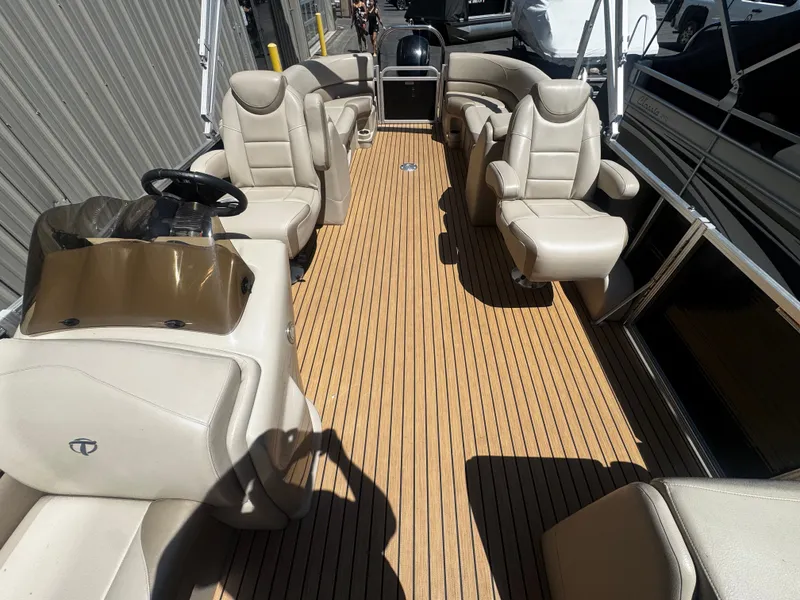Slide: The Image of 2017 Tahoe LTZ2685 pontoon boat with luxurious seating and wood deck. - 5