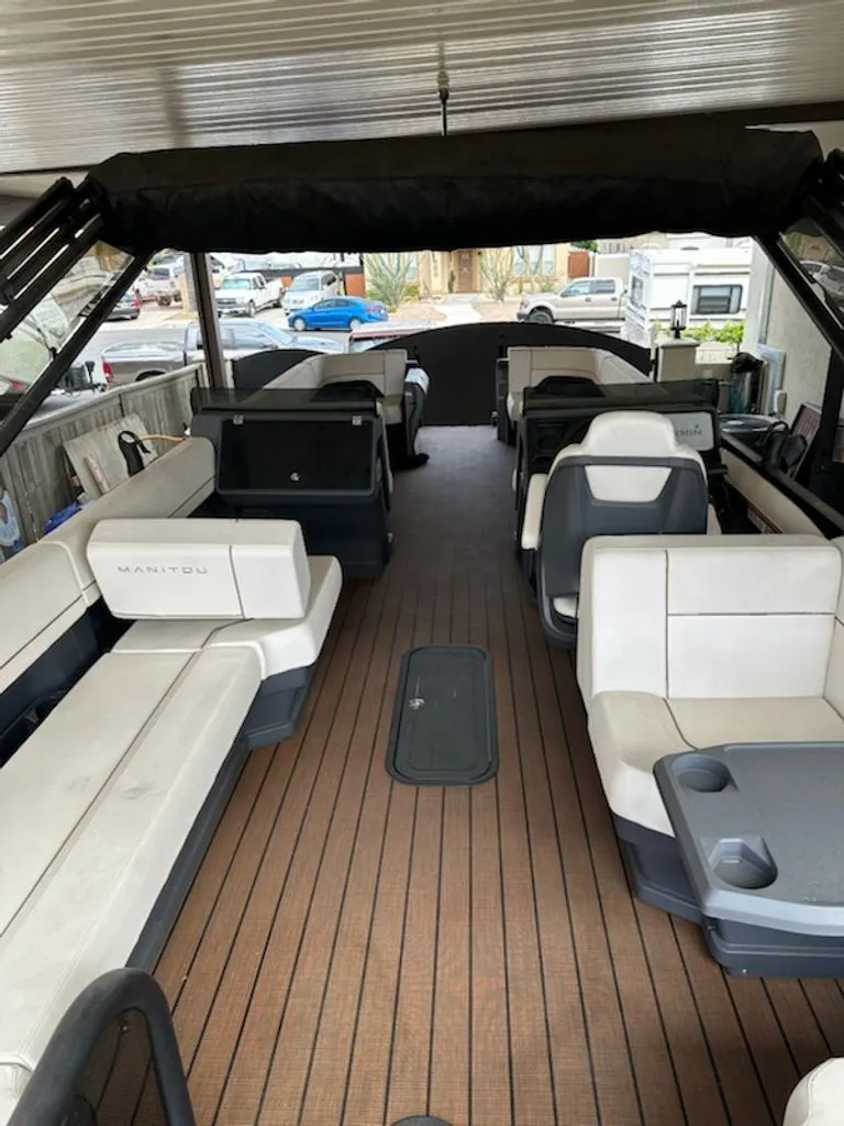 Slide: The Image of Interior of 2024 Manitou Switchback pontoon boat with seating. - 3