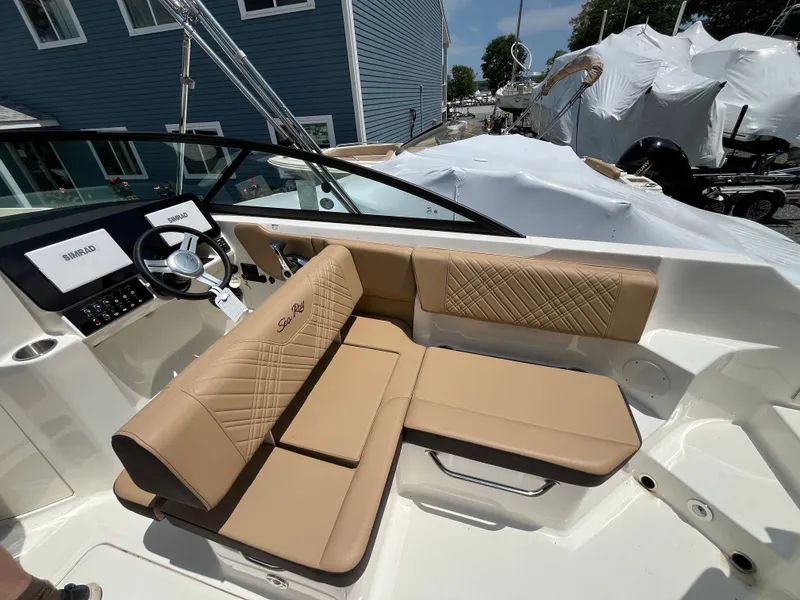 Slide: The Image of Interior of 2026 Sea Ray SDX 250 Outboard with beige seating. - 12