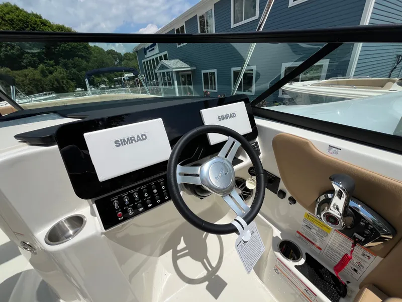 Slide: The Image of Interior view of 2026 Sea Ray SDX 250 Outboard cockpit. - 14