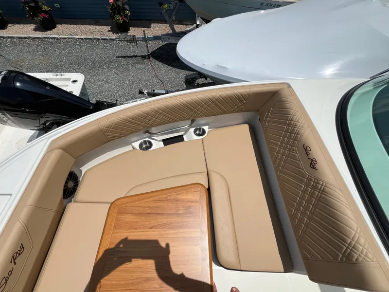 Slide: The Image of Interior of a 2026 Sea Ray SDX 250 Outboard with beige upholstery. - 19