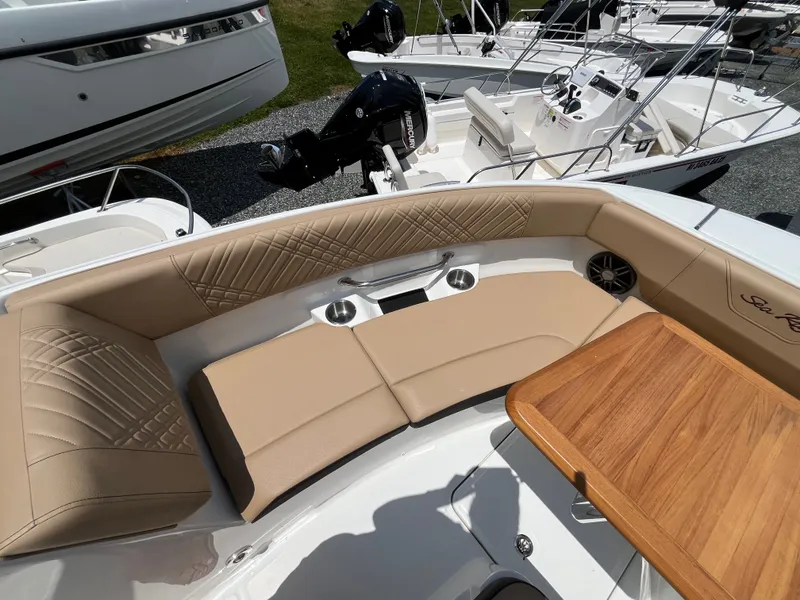 Slide: The Image of Interior of 2026 Sea Ray SDX 250 Outboard with beige seating. - 20
