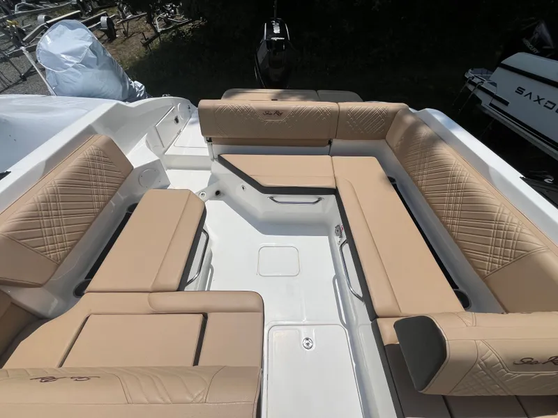 Slide: The Image of Interior of 2026 Sea Ray SDX 250 Outboard with beige seating. - 5