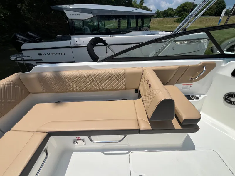 Slide: The Image of Interior of 2026 Sea Ray SDX 250 Outboard with beige seating. - 8