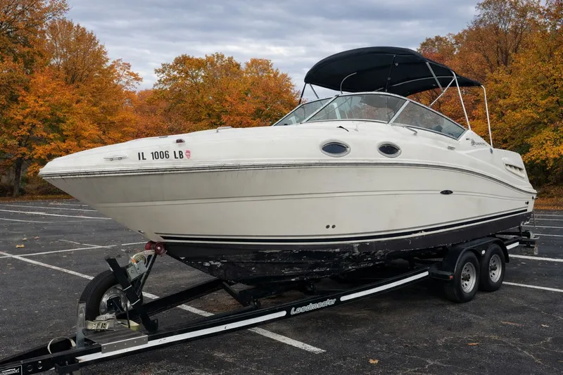 The Image of 2005 Sea Ray Sundancer 260 on trailer in autumn parking lot. - 0