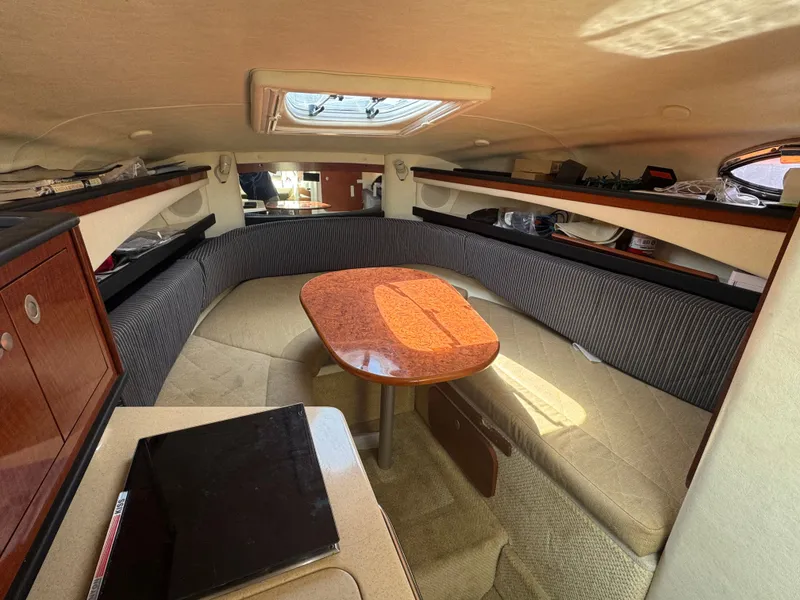 Slide: The Image of Interior of 2005 Sea Ray Sundancer 260 with cozy seating area. - 13