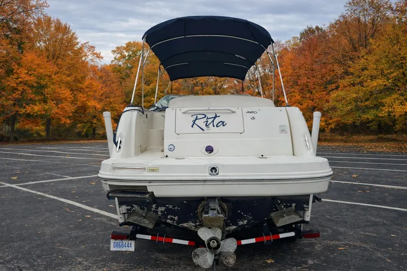 Slide: The Image of 2005 Sea Ray Sundancer 260 boat in autumn parking lot. - 2