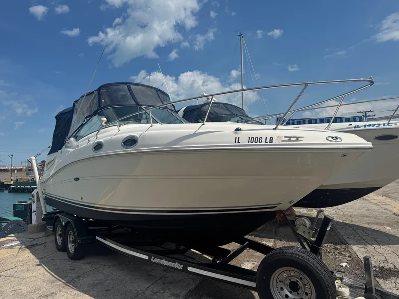 Slide: The Image of 2005 Sea Ray Sundancer 260 on trailer at harbor. - 3