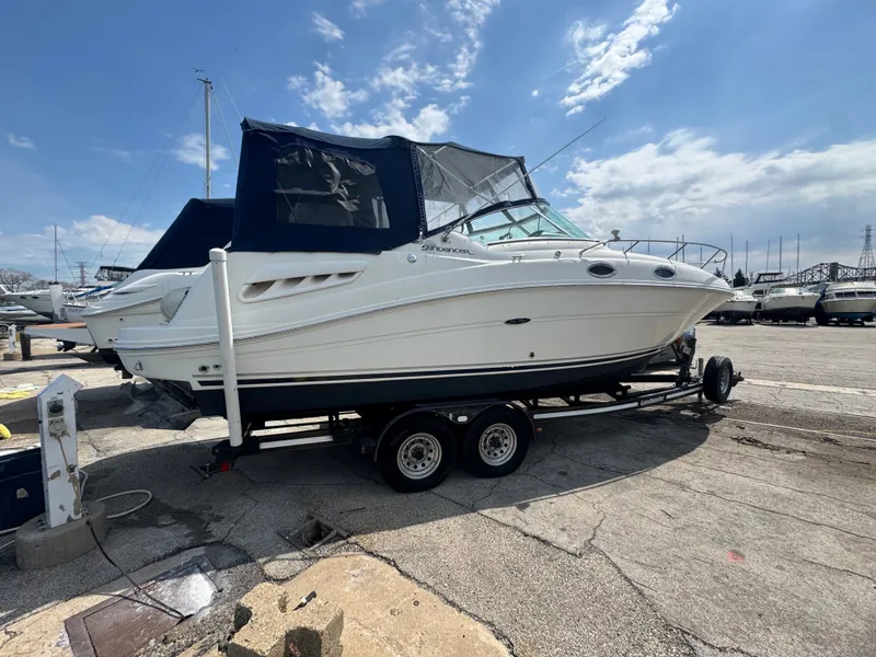 Slide: The Image of 2005 Sea Ray Sundancer 260 on a trailer outdoors. - 4