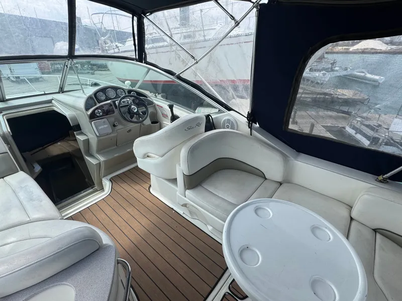 Slide: The Image of Interior of a 2005 Sea Ray Sundancer 260 with helm and seating area. - 5